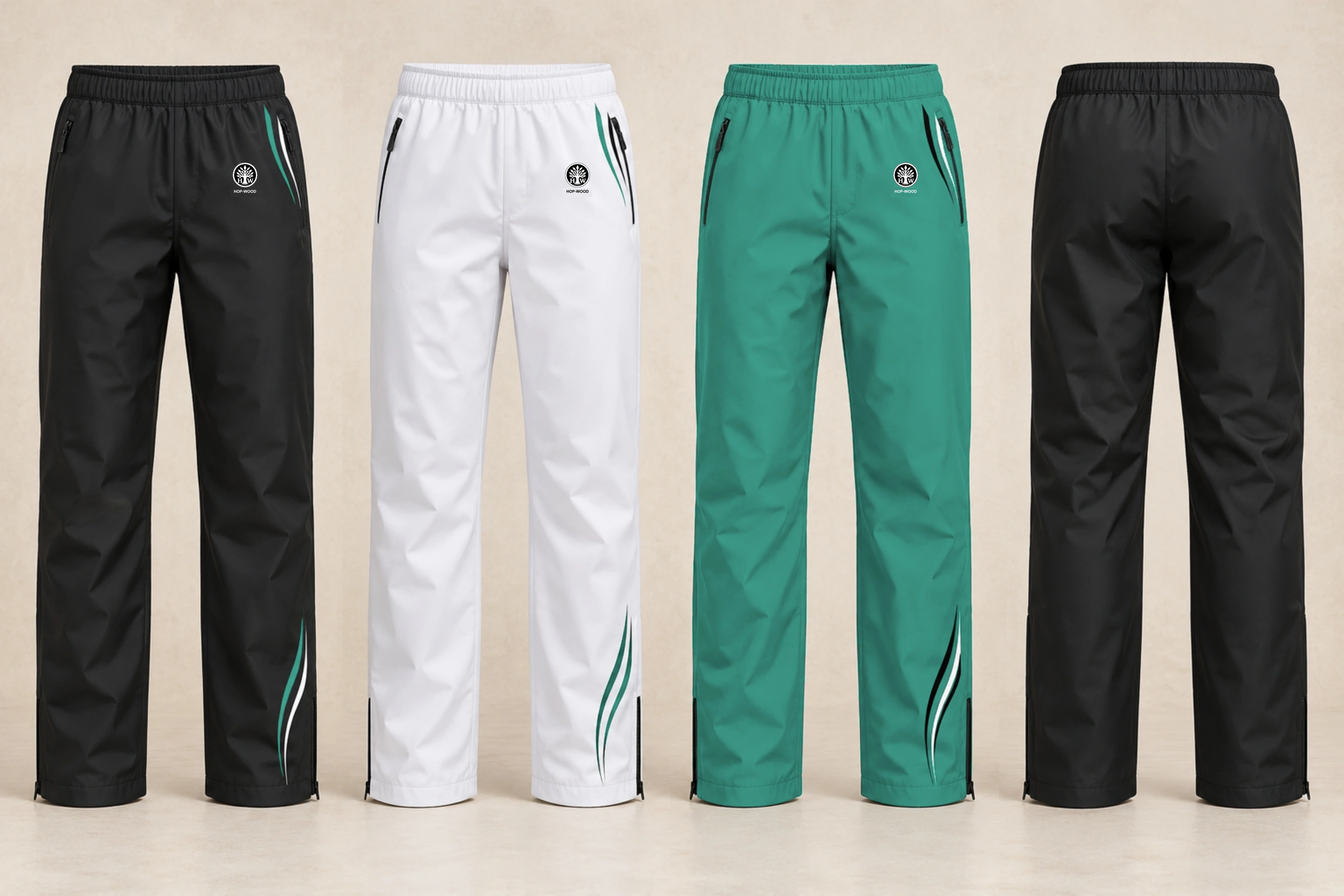 Rain over-trousers: black, white and green design previews with embroidered HOP-WOOD emblems